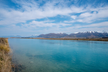 The turquoise waters of Lake Tekapo and its canal in New Zealand