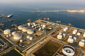 Aerial view or top view oil terminal is industrial facility for storage of oil and petrochemical. oil manufacturing products ready for transport and business transportation.