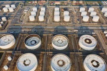 Aerial view or top view oil terminal is industrial facility for storage of oil and petrochemical. oil manufacturing products ready for transport and business transportation.
