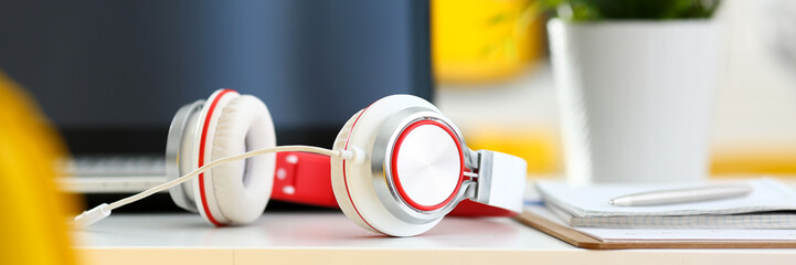 Empty remote office workplace with laptop pc and headset closeup. Receptionist or secretary of...