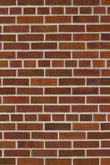 Vintage traditional red brown brick wall texture with common bond brickwork pattern