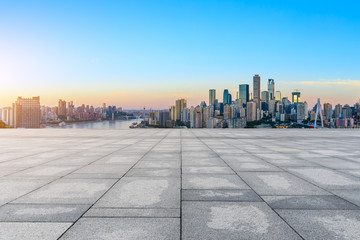 Empty square floor and modern city skyline in chongqing at sunrise,China.