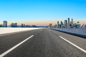 Obraz premium Asphalt highway passes through the city financial district in Chongqing at sunrise,China.