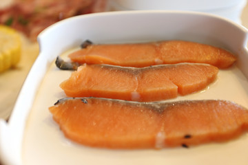 Naklejka na ściany i meble Selective focus of fresh sliced salmon fillet for cooking or shabu shabu and sukiyaki, Japanese food