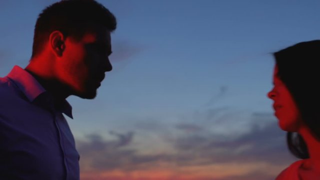 Woman going away leaving boyfriend alone on terrace, parting, relations crisis