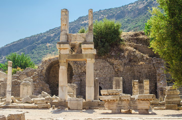 Turkey, Aegean, Izmir. Ruins of ancient Greek city Ephesus (Efes). Columns of white marble, destroyed buildings. Famous open-air museum. Popular tourist location. Selective focus.