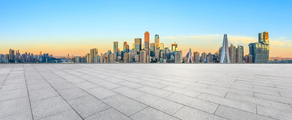 Empty square floor and modern city skyline in chongqing at sunrise,China.
