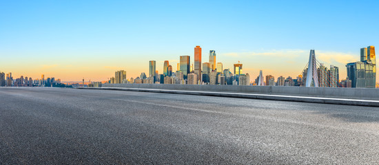 Obraz premium Asphalt highway passes through the city financial district in Chongqing at sunrise,China.