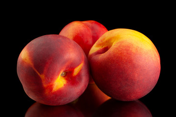 Ripe nectarine fruit on black