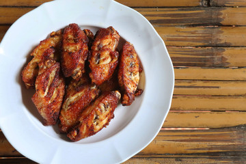 fried chicken wings  in white plate
