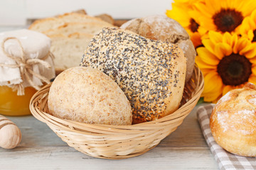 Buns and breads on breakfast table.