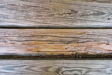 Naklejka premium .Background of several old wooden planks (boards without paint),detailed snapshot. Brown, ochre, grey, black.