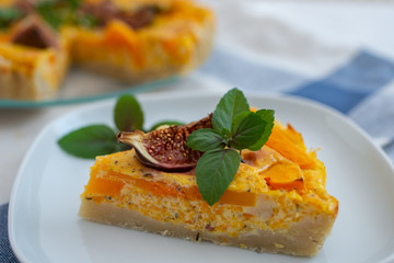 home made pumpkin quiche lorraine on a table