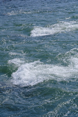 Rapid water splashes through the river