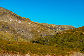 Power line voltage tower in mountains