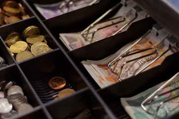 Czech crowns of various denominations in a cash drawer