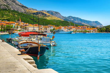 Harbor and moored touristic boats in Makarska resort, Dalmatia, Croatia © janoka82