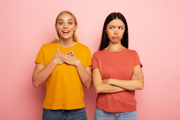 Friends receives likes and hearts from social network. But the blonde is happy and the brunette is...