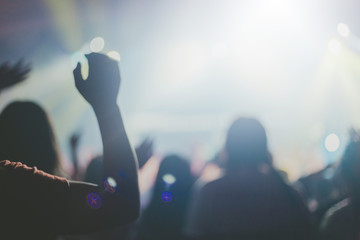 Blurred of Christian worship with raised hand,m