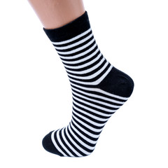 white and black  socks in the cage and stripes or polka dot on a white isolated background