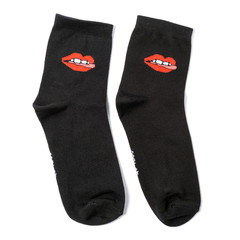 black wool socks .with their lips and teeth on them in the white isolated background