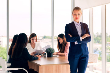 Business people or colleague standing posing while meeting and talking in office, professional executives coworkers discussion and brainstorming