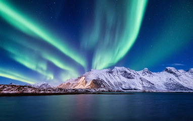 Aurora Borealis, Lofoten islands, Norway. Nothen light, mountains and ocean. Winter landscape at...