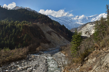 Annapurna Circuit Track- view of the river and Kali Gandaki canyon, on the background Tukuche Peak, near the village of Ghasa. Nepal, the Himalayas.