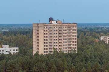 aerial view of the lost city of Pripyat. a lot of empty concrete floors overgrown with trees....