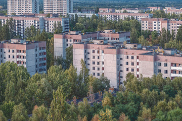 aerial view of the lost city of Pripyat. a lot of empty concrete floors overgrown with trees....