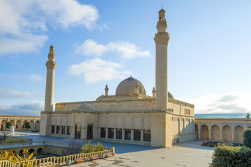 Fototapeta na wymiar Restored ancient Friday Cathedral Juma Mosque on a sunny day. Shemakhy, Azerbaijan