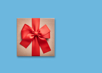 Gift box with a bow on a blue.