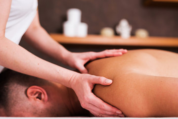 Man enjoying sports massage at spa