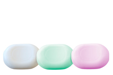 Three pieces of soap white, green and pink color isolated on white background