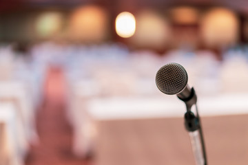 Close up of microphone in concert hall , conference seminar room background,selective focus,vintage color,copy space