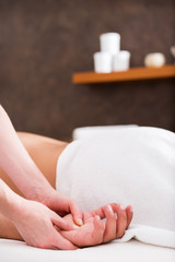 Obraz na płótnie Canvas Man enjoying sports massage at spa.