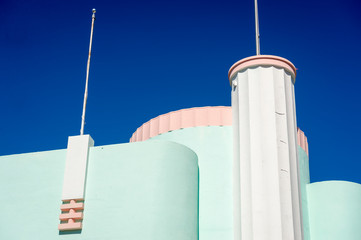 Detail of brightly colored Art Deco architecture in pastel pink and blue in Miami, Florida, USA