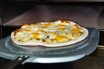 chef making pizza in the pizzeria