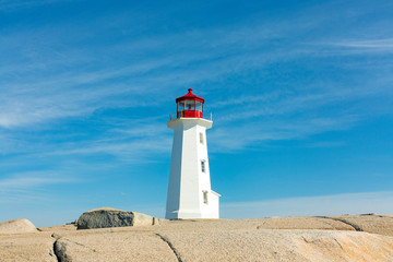Fototapeta na wymiar Lighthouse on a rock at peggys cove
