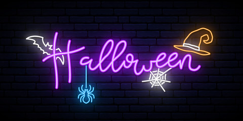 Happy Halloween neon concept banner. Bright Halloween lettering on dark brick wall background. © greens87