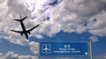 Plane landing in Hong Kong with signboard