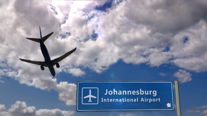 Fototapeta premium Plane landing in Johannesburg with signboard