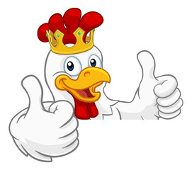 A chicken rooster cockerel bird cartoon character in a gold kings crown peeking over a sign and giving a double thumbs up