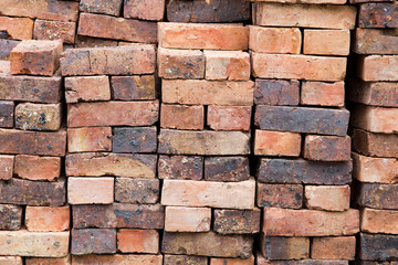 A stack of red clay bricks
