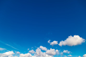 Puffy clouds on a blue evening sky