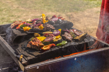 Hunter's food cooked on stone.