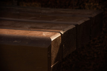 Part of a brown wooden bench