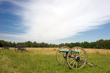 Row of civil war cannons on the battlefield