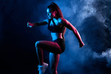 talented woman dancing in the night club, performance, entertainment. close up side view photo. isolated black background, studio shot