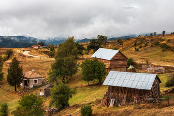 Fototapeta na wymiar Cloudy autumn day over highest village on Balkans and Bulgaria - Ortsevo in Rhodope mountain.